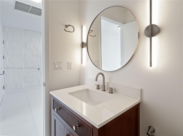 bathroom with tile patterned floors and vanity