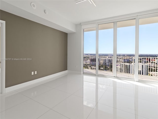 spare room with tile patterned floors