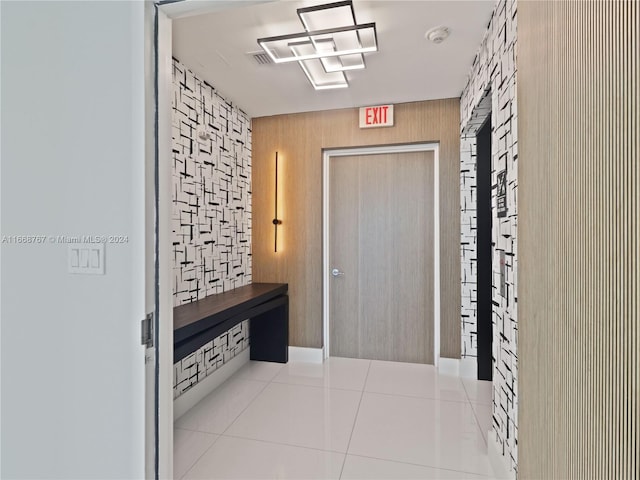 corridor with light tile patterned floors