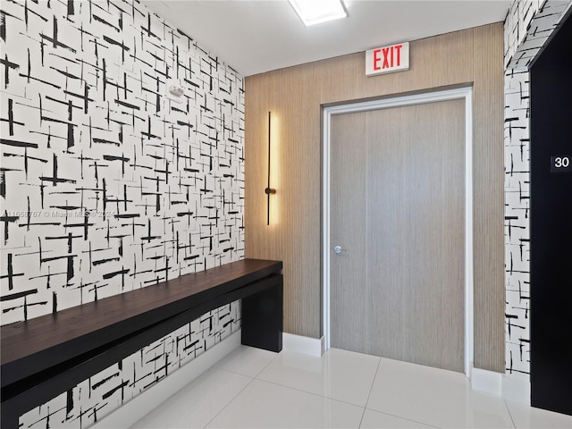 hallway with light tile patterned floors