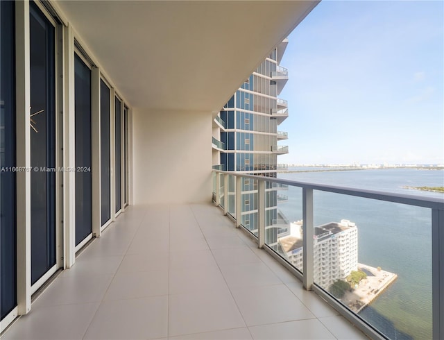 balcony featuring a water view