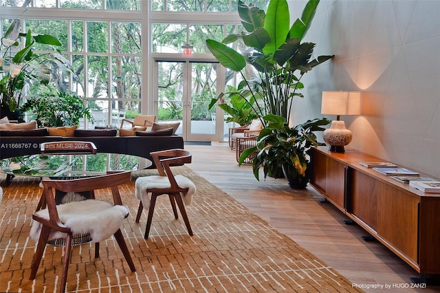 sunroom / solarium featuring french doors