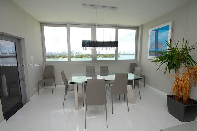 dining space featuring a water view