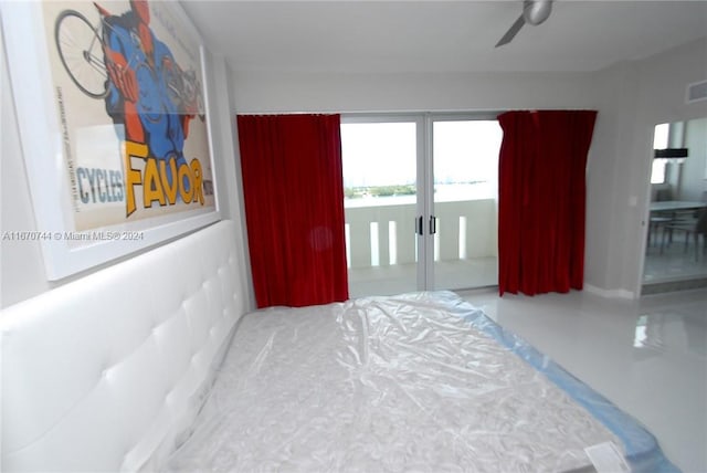 bedroom with access to outside, ceiling fan, and french doors