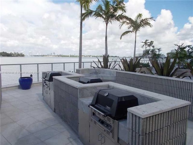 view of patio / terrace with a water view