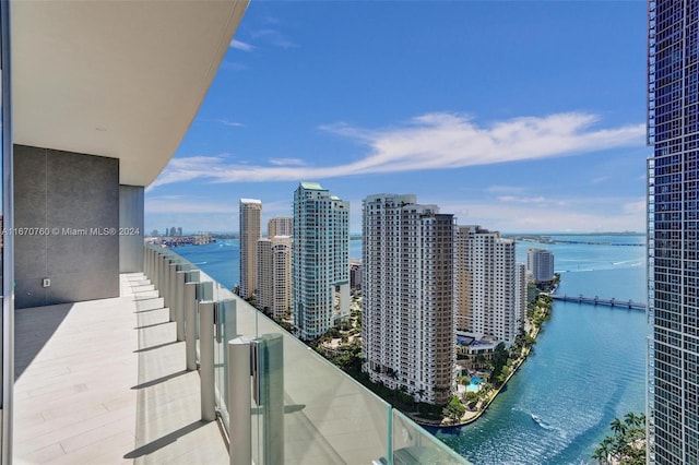 balcony featuring a water view