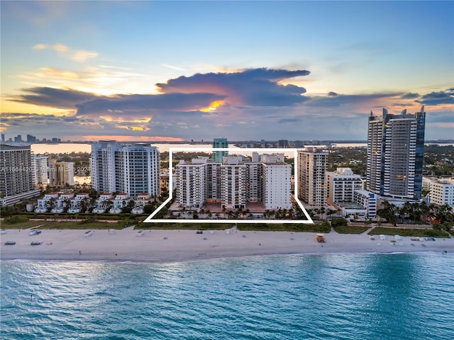 exterior space with a water view and a view of the beach