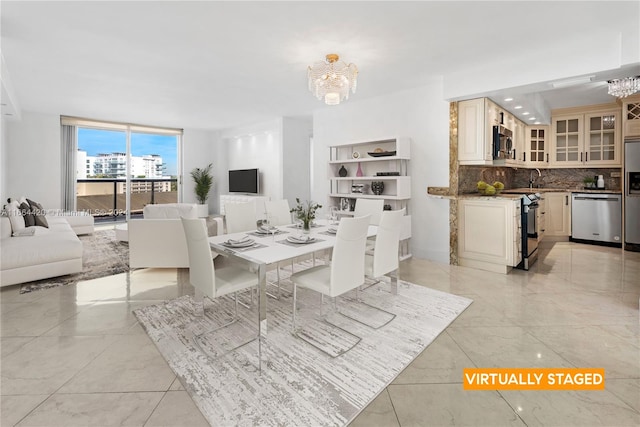 tiled dining room featuring an inviting chandelier