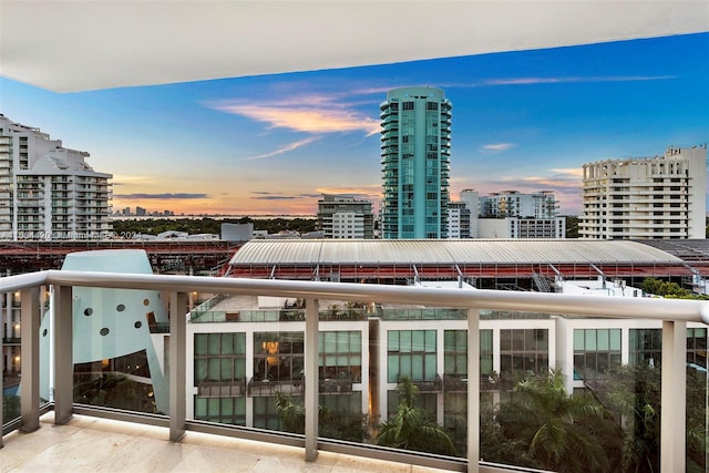 view of balcony at dusk