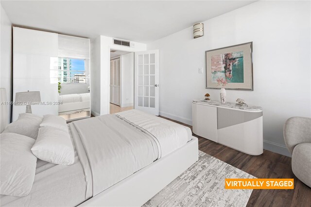 bedroom with wood-type flooring