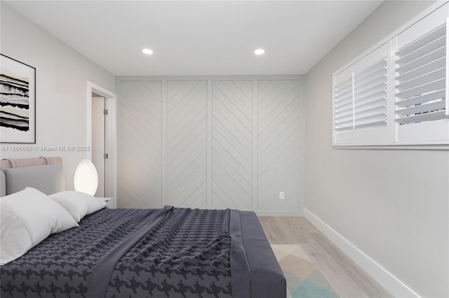 bedroom with light hardwood / wood-style flooring