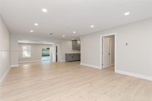 unfurnished living room with light wood-type flooring