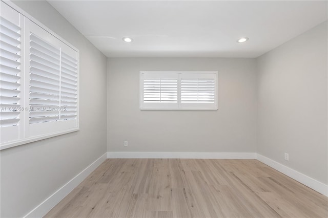 spare room with light wood-type flooring