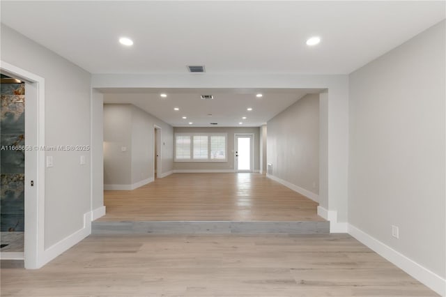 spare room with light wood-type flooring