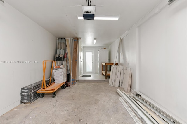 garage featuring white fridge