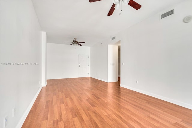 empty room featuring light hardwood / wood-style flooring and ceiling fan