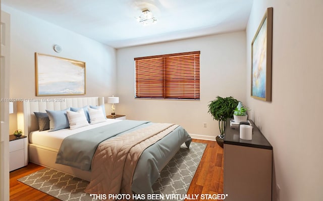 bedroom featuring dark wood-type flooring