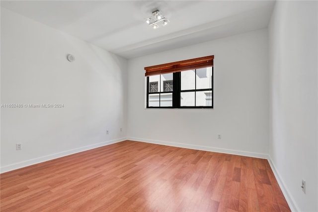 unfurnished room featuring light wood-type flooring