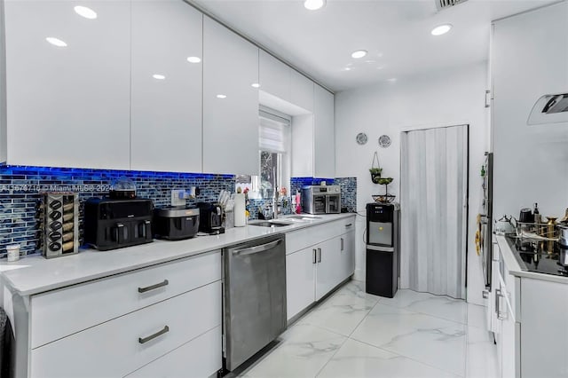 kitchen with backsplash, white cabinetry, dishwasher, and sink