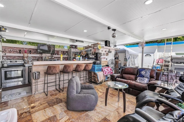 living room with beam ceiling