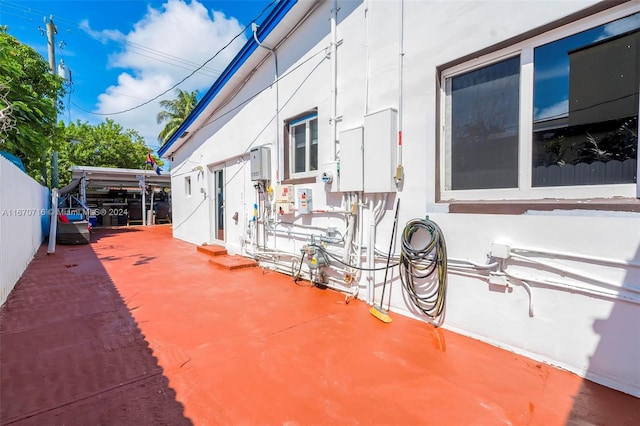 view of side of home featuring a patio