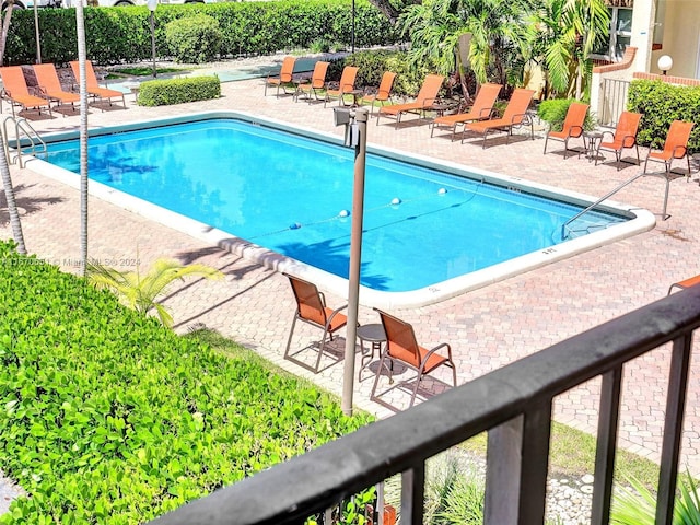 view of swimming pool featuring a patio area