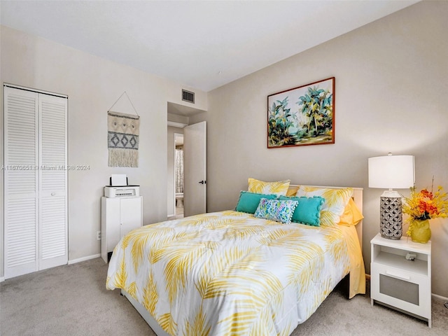 carpeted bedroom featuring a closet