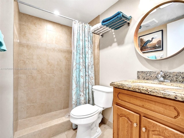 bathroom with toilet, tile patterned flooring, a shower with curtain, and vanity