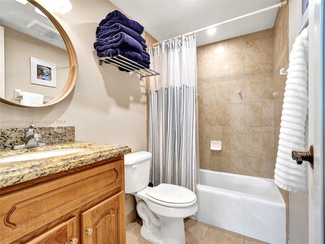 full bathroom featuring toilet, tile patterned flooring, vanity, and shower / bath combo with shower curtain