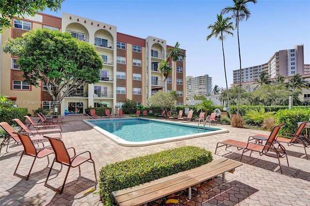 view of swimming pool with a patio area