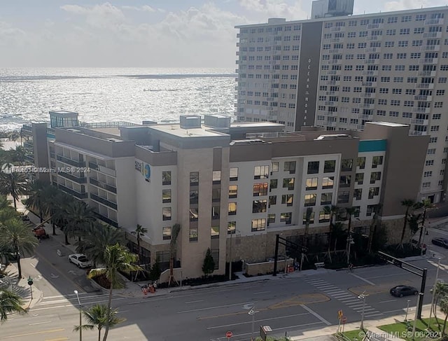 view of building exterior with a water view