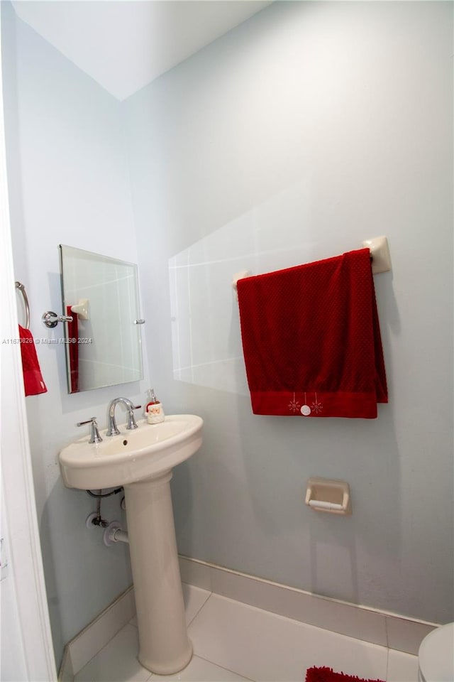 bathroom featuring tile patterned flooring and toilet