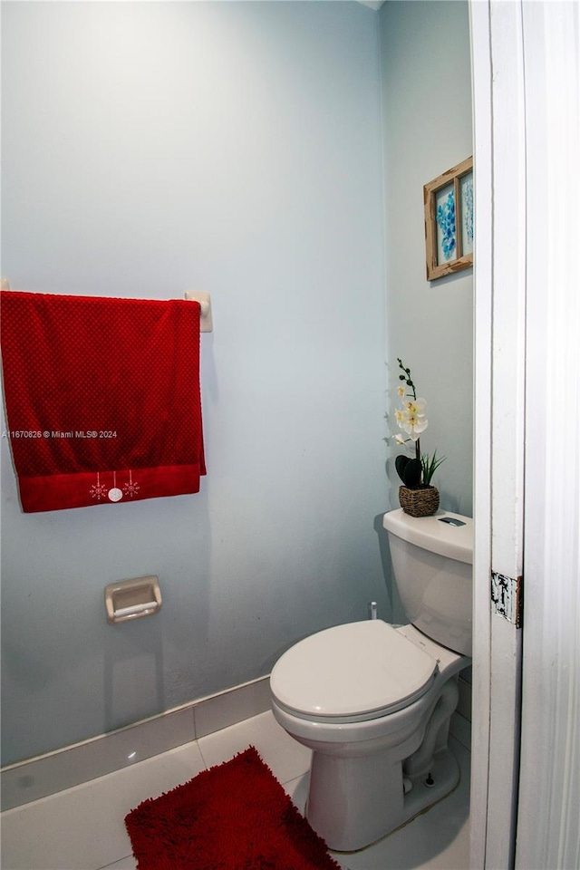 bathroom featuring toilet and tile patterned floors