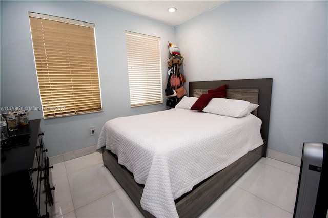 bedroom with light tile patterned flooring