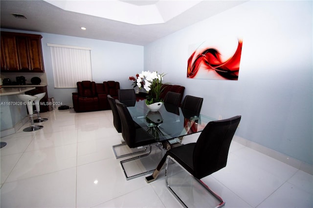 dining area with light tile patterned floors