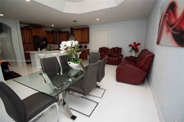 dining space featuring light tile patterned floors