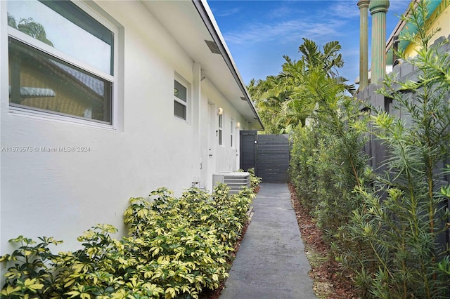 view of side of property with central air condition unit