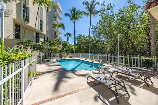 view of swimming pool featuring a patio area