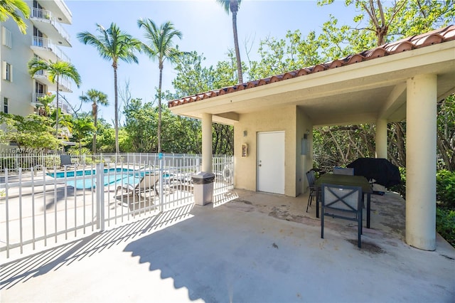 view of patio with a community pool