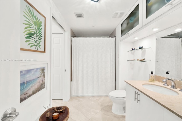 full bathroom featuring vanity, shower / tub combo with curtain, and toilet