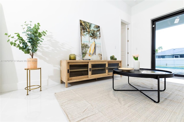 living area with tile patterned flooring and plenty of natural light