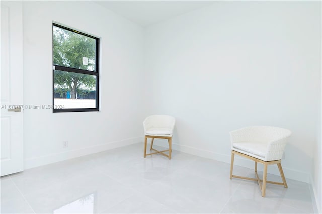 unfurnished room with light tile patterned floors