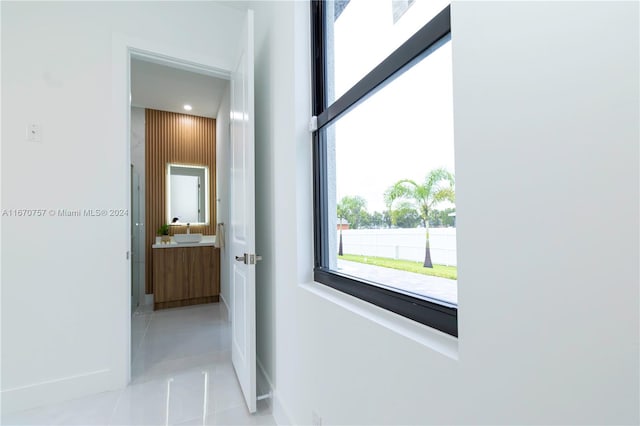 hallway with light tile patterned flooring