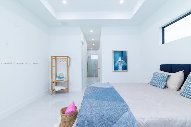 bedroom featuring a raised ceiling