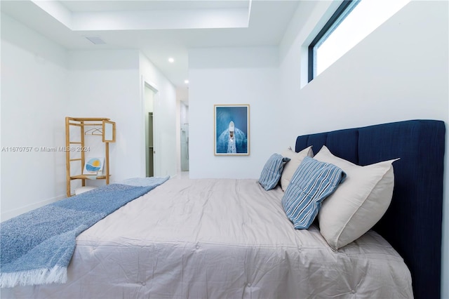 bedroom with a tray ceiling