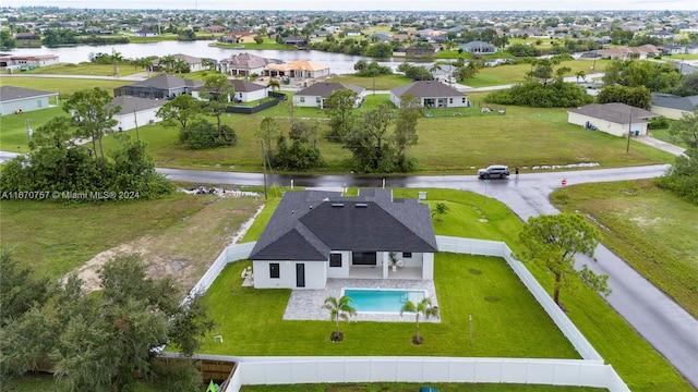 bird's eye view with a water view