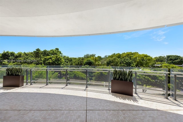 view of patio featuring a balcony