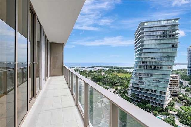 balcony featuring a water view