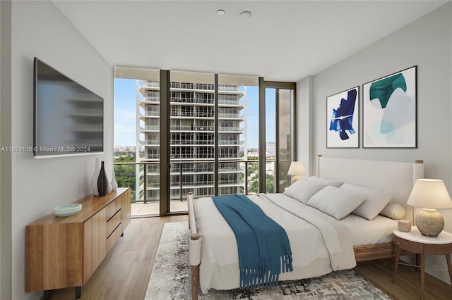 bedroom with access to exterior, light hardwood / wood-style floors, and expansive windows