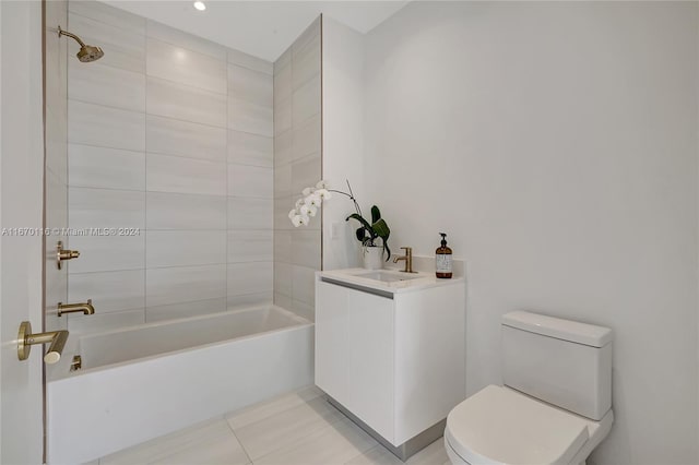 full bathroom with tile patterned floors, vanity, toilet, and tiled shower / bath combo